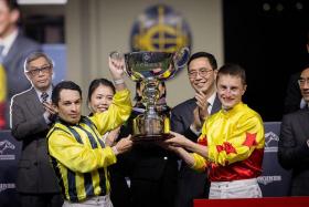 Silvestre de Sousa (left) and Tom Marquand lifting the 2022 Longines International Jockeys&#039; Championship trophy after they &quot;dead-heated&quot; for the top honours in the four-race challenge. 