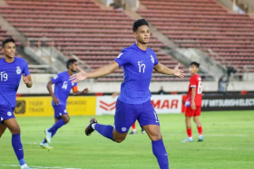 Irfan Fandi celebrates after giving Singapore the lead against Laos in an AFF Championship Group B match. 
