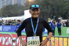 Chow Yun Fat, 67, at the Standard Chartered Hong Kong Marathon in Hong Kong on Sunday (Feb 12).