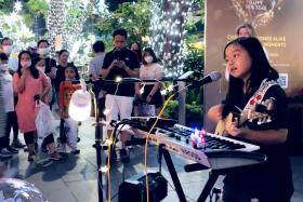 Lyla Ng, 10, performs Mandarin and English songs at various locations in Singapore.