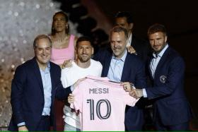 (From left) Inter Miami managing owner Jorge Mas, Lionel Messi, and club co-owners Jose Mas and David Beckham during “The Unveil”. 