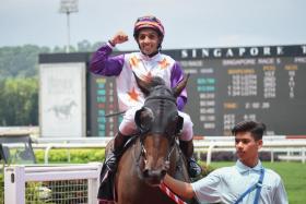 Bruno Queiroz saluting on Roda Robot after their victory on Aug 27. Manoel Nunes could not make the 51.5kg weight then and will be back on board on Saturday. PHOTO: SYAMIL SAPARI