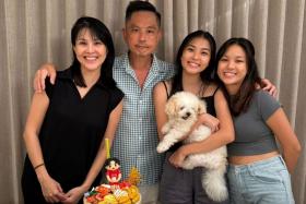Chew Chor Meng celebrating his birthday with (from left) his wife Deon and their two daughters, Chloe, 21, and Cheyenne, 19.