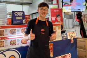 Mr Derek Cheong at his GoPizza stall in Pasir Ris.