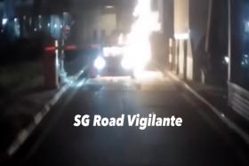 The video shows the car catching fire as it approaches the gantry.
