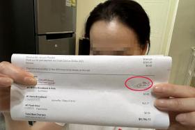 Ms Lin with the phone bill.