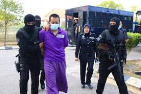 Hafizul Harawi being taken to court on April 16.