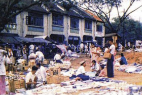 Vendors hawking their wares at the Holland Village of the past.