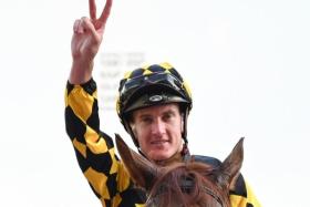 Sydney-based British jockey Chad Schofield saluting the crowd after winning the Group 3 Fortune Bowl (1,400m) at Kranji on Feb 11.
