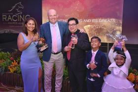 Team Lim's Kosciuszko posing proudly with their trophies at the 2023 Singapore Racing Awards held at the Singapore Turf Club on May 28, with Sabrina (far left) joining her trainer husband Daniel Meagher, Lim's Stable's principal owner Lim Siah Mong, and the Meaghers' children Caiden and Harper Rose.