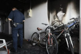 The blackened walls and ceiling of the corridor where the fire broke out.