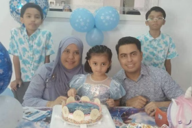Mr Mohammed Ashraff Hussin and his wife Mardalina Mohamed Nossi with their children (from left) Qayyim Fazhan, Raisya Ufairah and Qayyim Iylhan.