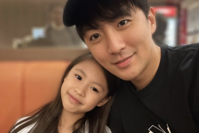 Hong Junyang with his daughter Azalea.