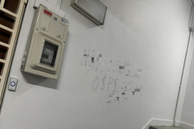 The man scribbled on the wall next to the unit.