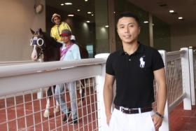 Hong Kong jockey Matthew Poon catching the Kranji action at the Raffles Cup meeting on Aug 11. He flew in for a three-day visit.