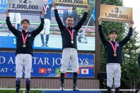 Brazilian jockey Joao Moreira standing on top of the podium at the conclusion of the World All-Star Jockeys series in Sapporo on Aug 25. Japanese jockeys Yutaka Take (left) and Ryusei Sakai finished second and third respectively.
