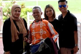 Veteran jockey Saifudin Ismail celebrating his Kranji race-to-race double on Pacific Sonic with wife Saleena Lim (left), eldest son Shammel and the latter&#039;s girlfriend Nasuha on Sept 1.

