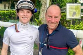 Ex-jockey Simon Price taking in the old familiar sights at Kranji with his jockey-son Will Price on Oct 3.