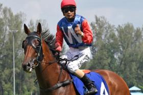 Jockey Shafiq Rizuan bringing Witnessimpact back to scales after his win in the Power Toto 6/55 Stakes (1,100m) on Oct 13.
