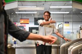 Mr Husri Hussein, an assistant station manager at Dover MRT station, gently approached the young man with special needs and calmed him down.