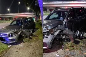 Photos of the aftermath show a black Mercedes with its front left wheel dislodged and damage to its front left side.
