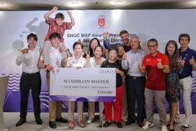 Maximilian Maeder (second from left) collecting $250,000 for his Olympic bronze medal from SNOC president Grace Fu (fourth from left) and Minister for Culture, Community and Youth Edwin Tong (third from right).