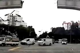 In a video posted on SG Road Vigilante on Facebook on Oct 3, the metal bar narrowly misses a lorry that is making a turn.