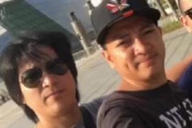 Mr Erwin Gonzales (left) and his younger brother German Jr Miranda Gonzales, who died after he was run over by a bus.