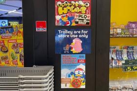 A sign outside Don Don Donki's Paya Lebar Quarter Mall outlet says it will discontinue the sale of plastic bags from Oct 1.