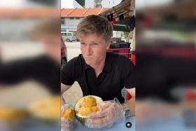 Australian wildlife conservationist Robert Irwin seemed overwhelmed by the taste and smell of durian in Singapore.