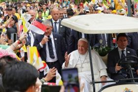 Pope Francis greeting Roman Catholics at Jurassic Mile on Sept 11.