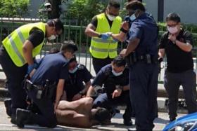 A video of the incident on Aug 21 shows a group of uniformed police officers confronting a man in the middle of Fullerton Road.