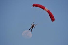 Red Lion Shirley Ng descends in a free-fall jump over The Float @ Marina Bay on Aug 9, 2022.