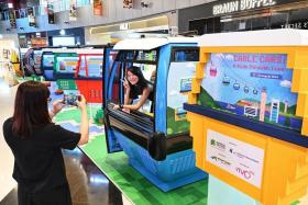 Visitors may sit inside a decommissioned second-generation cable car to experience the original journey from Mount Faber to Sentosa.