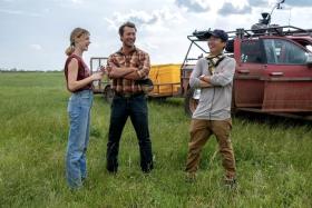 (From left) Actors Daisy Edgar-Jones and Glen Powell and director Lee Isaac Chung on the set of Twisters.