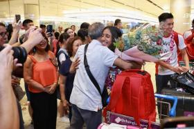 Shanti Pereira receiving a hug from her uncle Bernard Pereira upon arriving at Changi Airport on Oct 5, 2023.