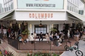 Customers wait in line at Columbus Coffee Company, at Upper Thomson, where the pop-up was held, on May 31.