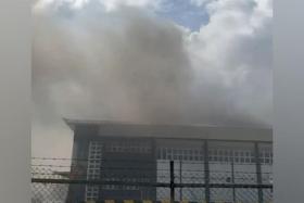 Smoke emitting from the second floor of a two-storey industrial building at Fishery Port Road on June 28.