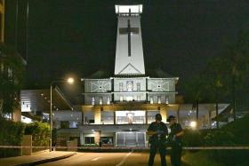 Police cordoning off the entrance of St Joseph’s Church in Bukit Timah after a stabbing incident on Nov 9.