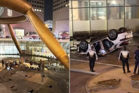 Photos of the Suntec City accident posted on social media show an overturned light-coloured car, with debris scattered in the vicinity.