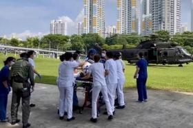 An injured crewman being attended to at Singapore General Hospital after being airlifted there on RSAF’s Rescue 10 H225M medium-lift helicopter.