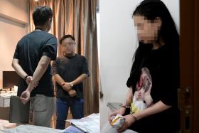 An ICA officer interviewing a man (left) suspected of being in a sham marriage during a raid on Dec 11, 2024. A Vietnamese woman suspected of being in a sham marriage was also arrested.