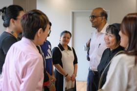 President Tharman Shanmugaratnam and his wife Jane Ittogi meeting guests and beneficiaries of AWWA's FEP on July 17.