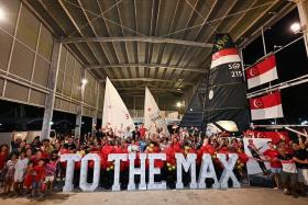 Supporters of Maximilian Maeder taking a group photograph at National Sailing Centre after the final is postponed.