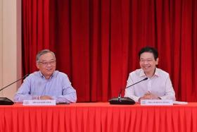 Minister for Trade and Industry Gan Kim Yong (left) and DPM Lawrence Wong at a press conference announcing the new Cabinet line-up on May 13.